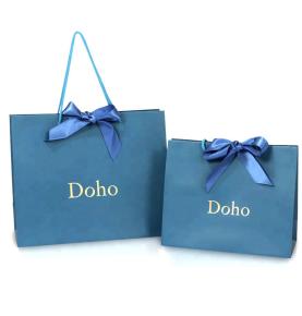 China Manufacturers Fancy Blue Laminate Gift Bags Customized Paper Bag With Pp Handle  and Bows